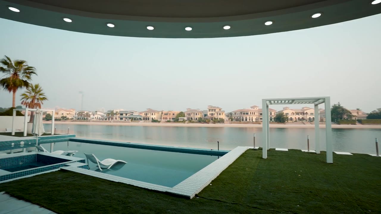 Rooftop view over the Palm Jumeirah lagoon at dusk